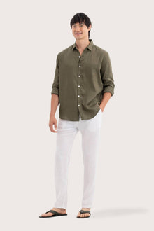 Side profile of the Baron Linen Shirt Green highlighting its easy, breathable fit by By The Sea Bali