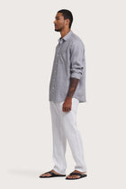 Side profile of the Baron Linen Shirt Grey highlighting its easy, breathable fit by By The Sea Bali
