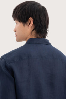 Open collar and button-front detail of the Baron Linen Shirt Navy by By The Sea Bali