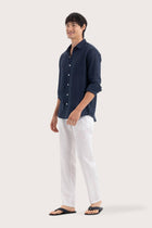 Side profile of the Baron Linen Shirt Navy highlighting its easy, breathable fit by By The Sea Bali