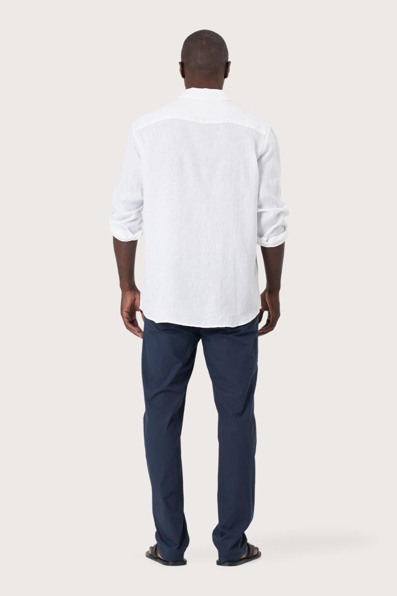 Back view of the Baron Linen Shirt White showcasing its tailored finish by By The Sea Bali