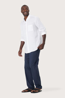 Side profile of the Baron Linen Shirt White highlighting its easy, breathable fit by By The Sea Bali