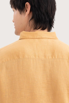 Open collar and button-front detail of the Baron Linen Shirt Yellow by By The Sea Bali
