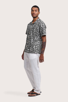Side profile of the Baronang Cotton Shirt Veg and Crab in Grey highlighting its easy, breathable fit by By The Sea Bali