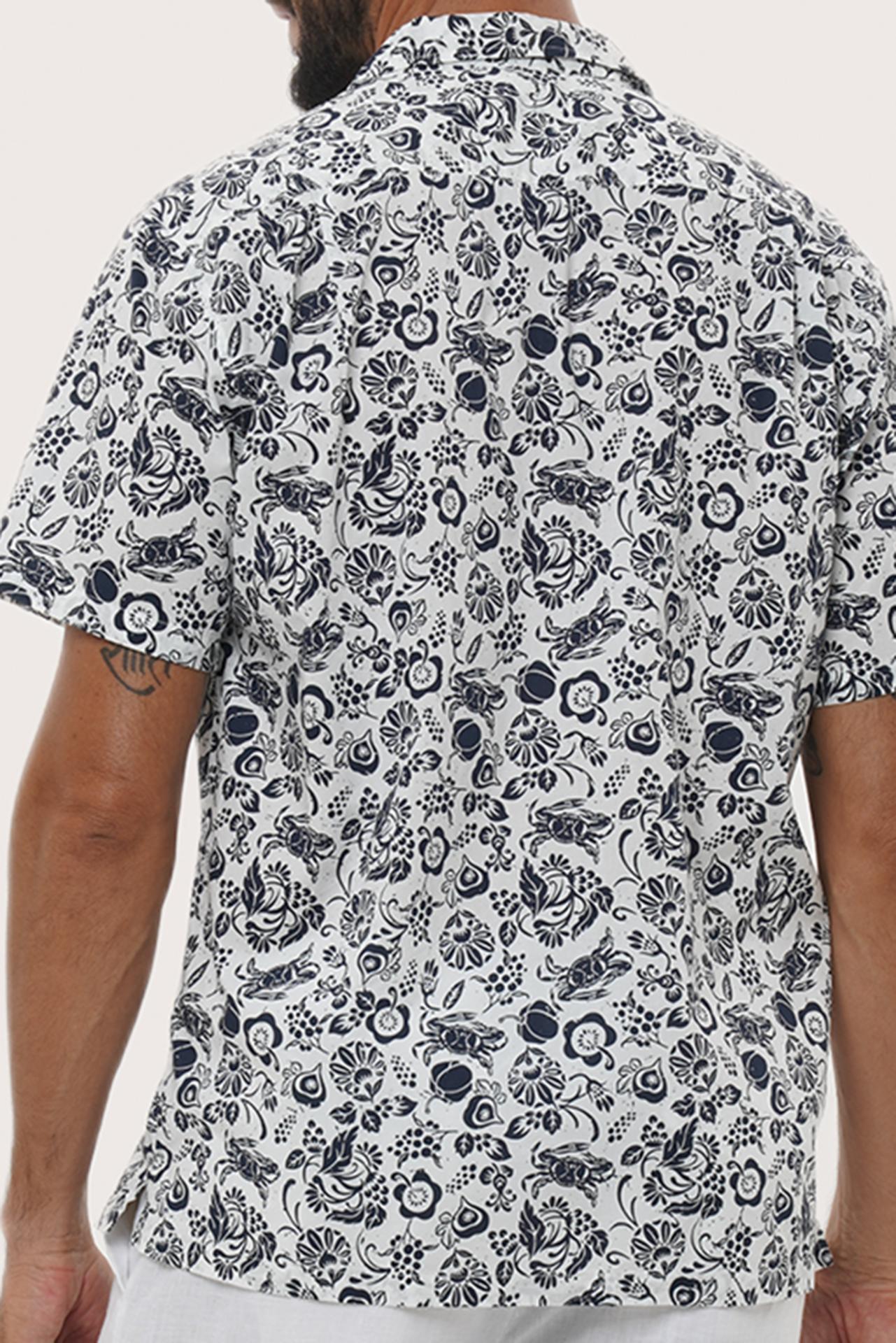 Men's resortwear styling featuring the Baronang Cotton Shirt in Veg and Crab White by By The Sea Bali