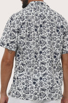 Men's resortwear styling featuring the Baronang Cotton Shirt in Veg and Crab White by By The Sea Bali