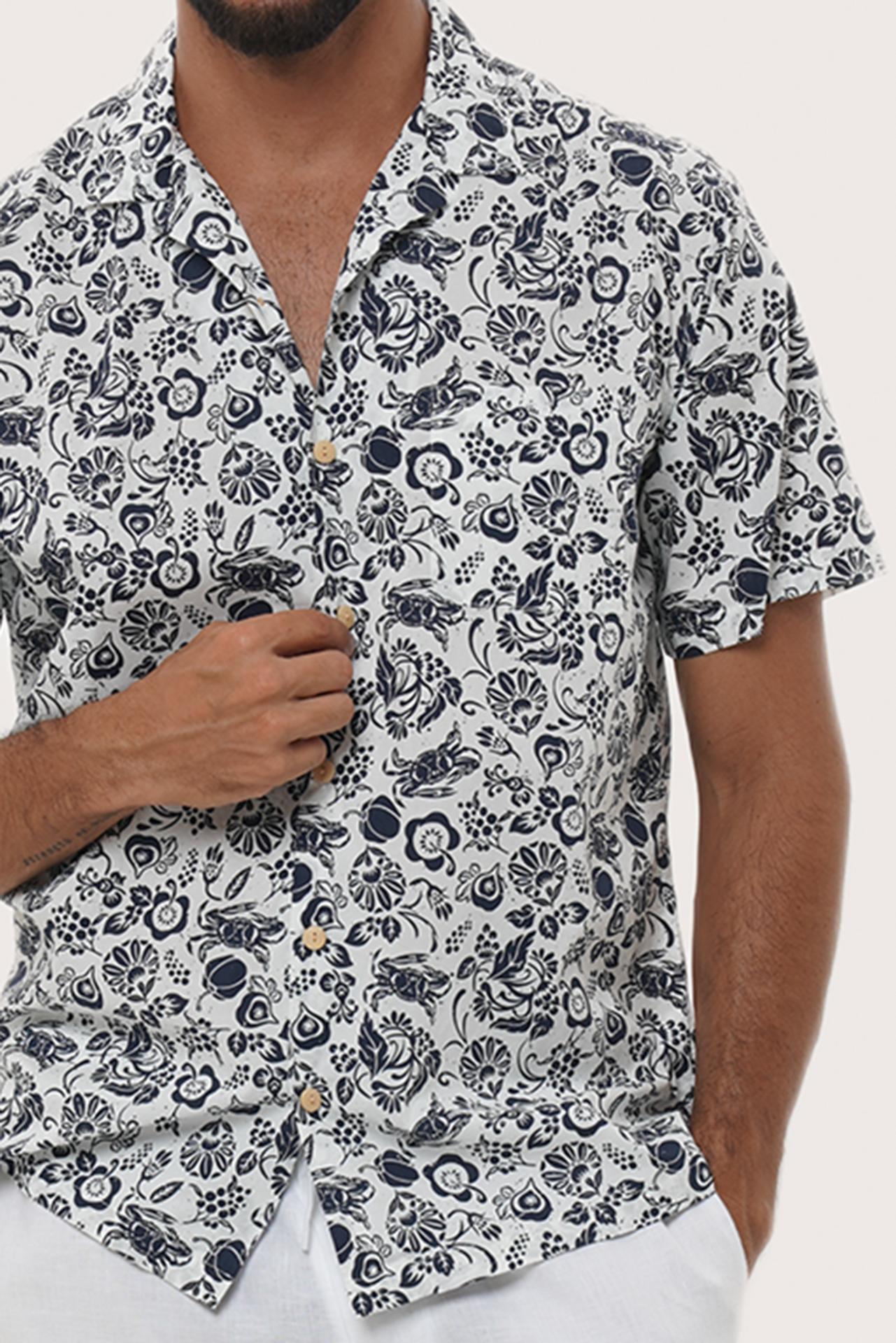 Collar and button-front detail of the Baronang Cotton Shirt in Veg and Crab White by By The Sea Bali