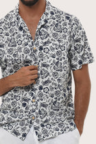 Collar and button-front detail of the Baronang Cotton Shirt in Veg and Crab White by By The Sea Bali