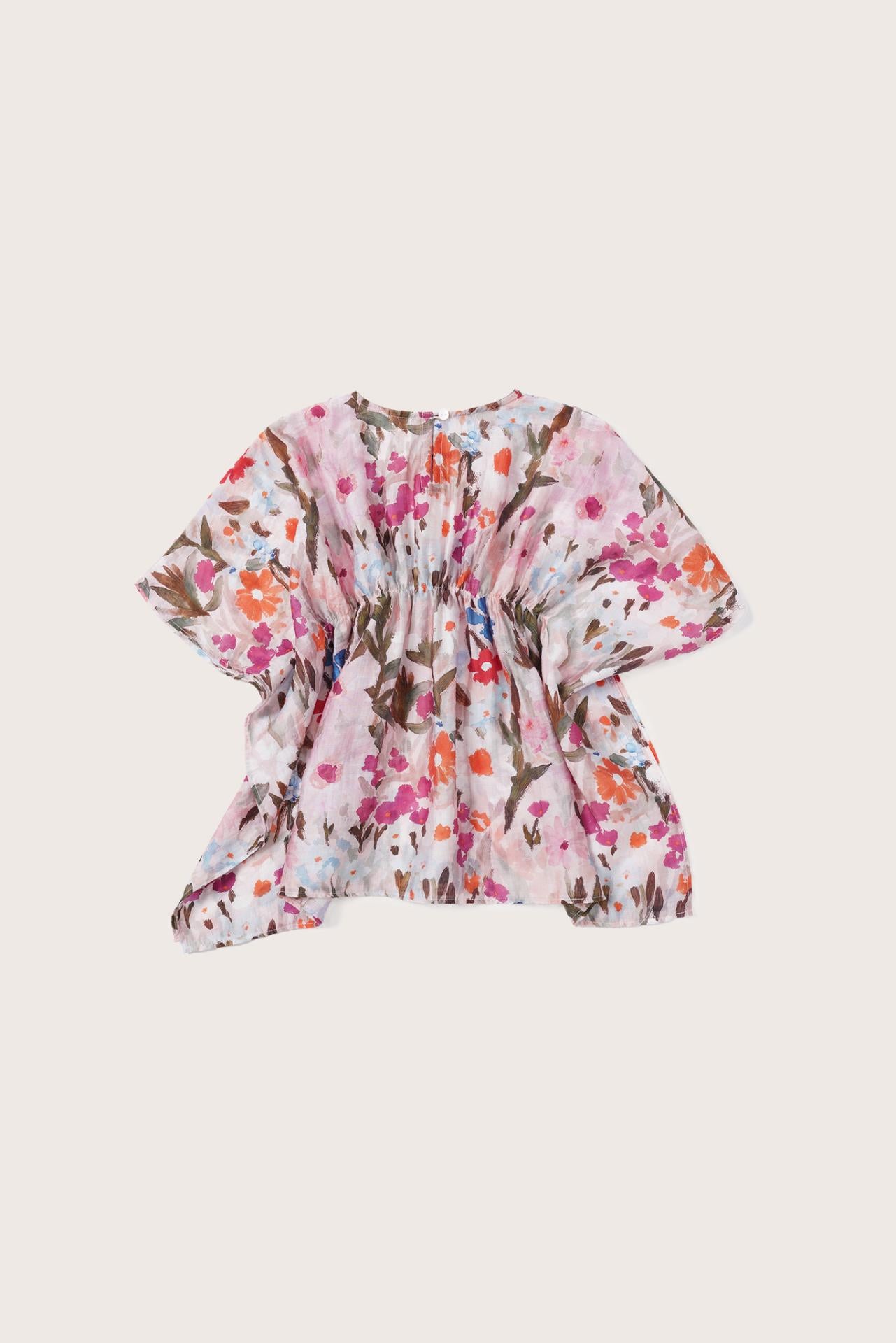 Elegant back view showcasing the flowing silhouette and artistic floral pattern