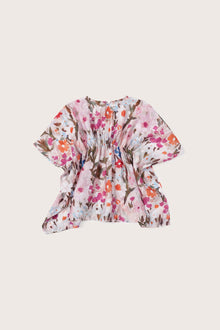 Elegant back view showcasing the flowing silhouette and artistic floral pattern