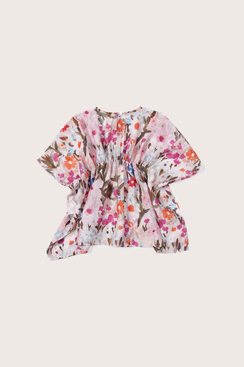 Elegant back view showcasing the flowing silhouette and artistic floral pattern