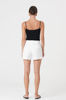Back view of the Besca Linen Short Off White highlighting the garment shape and drape