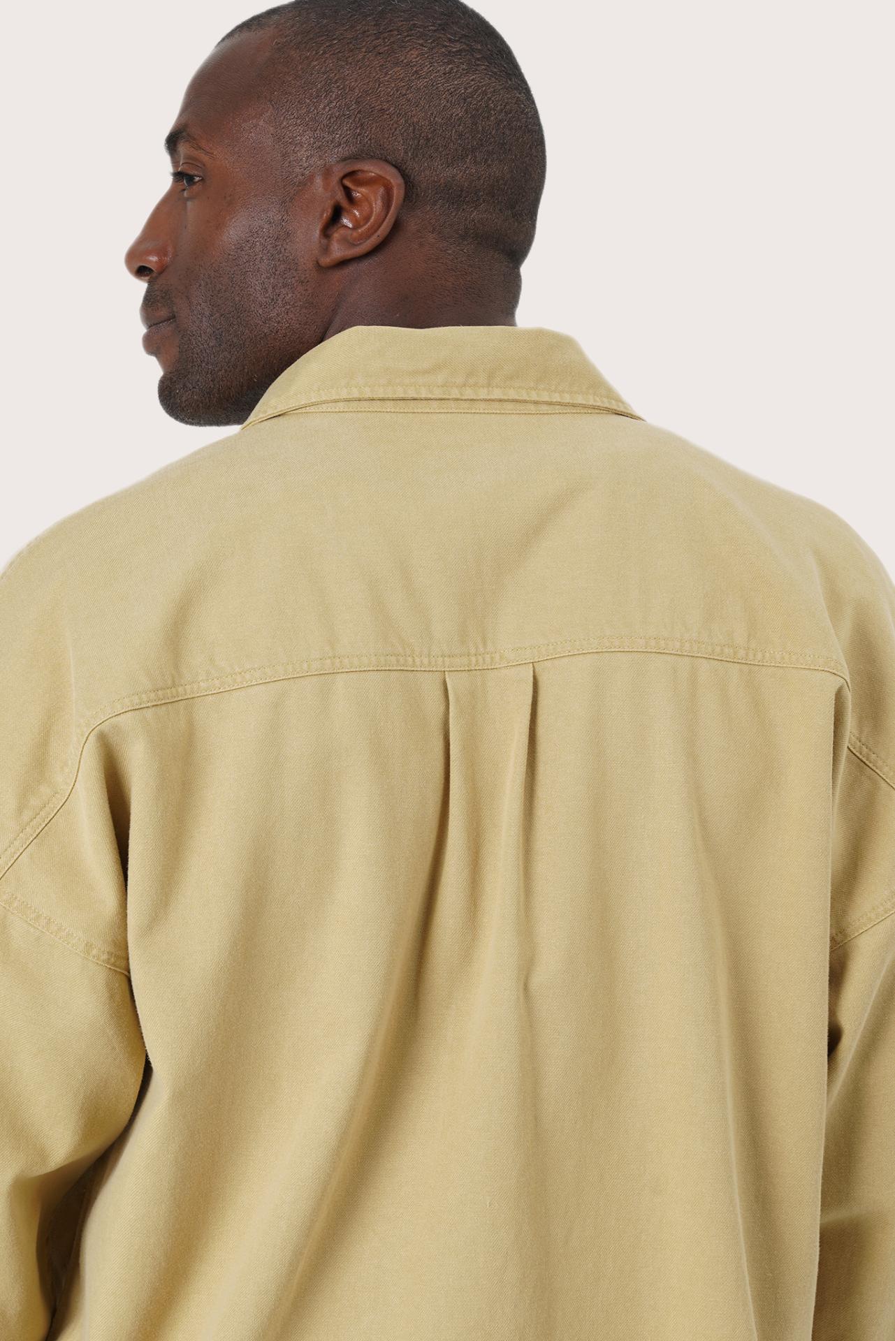 Detailed back view highlighting the jacket construction and relaxed silhouette