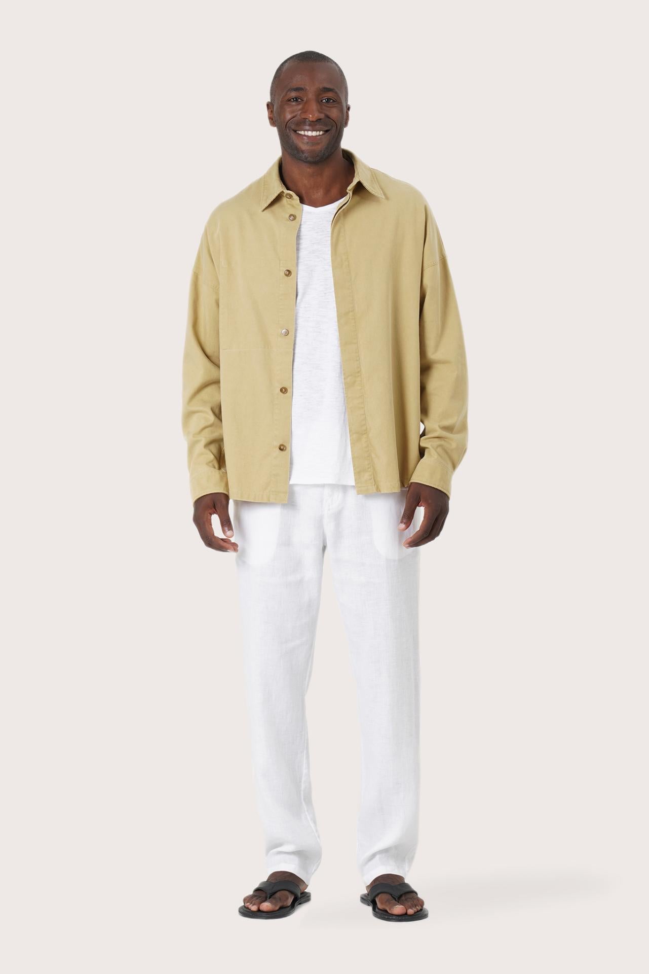 Model wearing the light yellow Birco jacket by By The Sea Bali