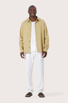 Model wearing the light yellow Birco jacket by By The Sea Bali