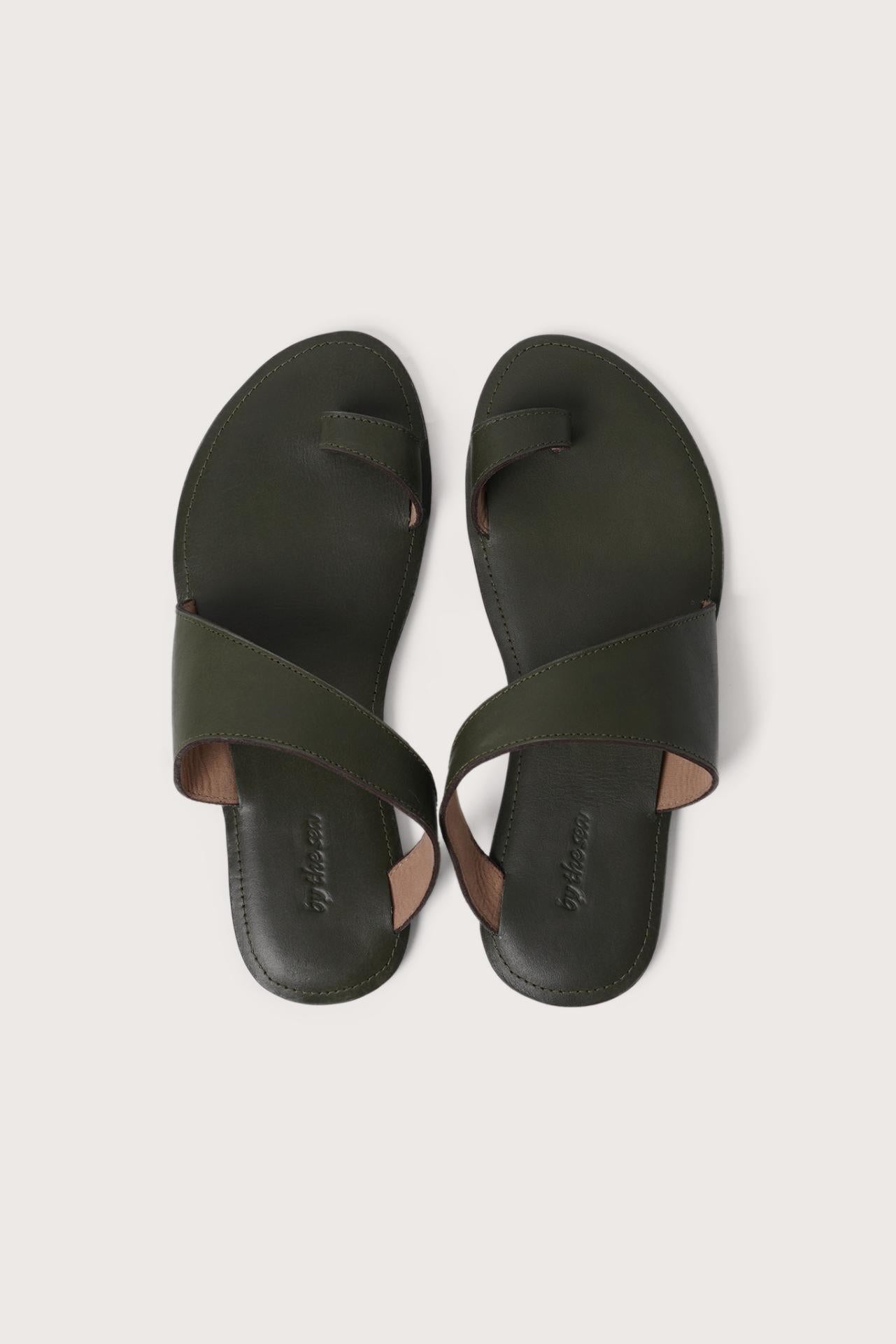 Bitsy sandal in green shown in a global view highlighting its full silhouette and resort-ready design
