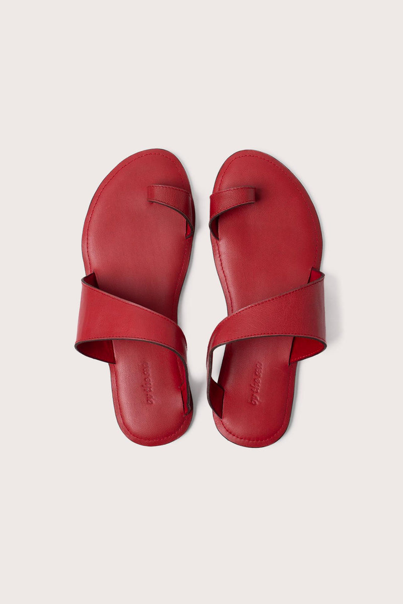 Bitsy sandal in red shown in a global view highlighting its full silhouette and resort-ready design