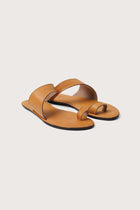 Bitsy sandal in yellow front view showcasing refined straps and elegant minimalist structure