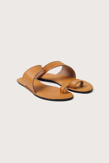 Bitsy sandal in yellow front view showcasing refined straps and elegant minimalist structure