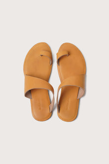 Bitsy sandal in yellow shown in a global view highlighting its full silhouette and resort-ready design