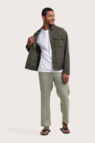 Model wearing the army green Broo jacket by By The Sea Bali