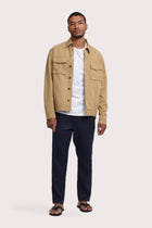 Model wearing the light beige Broo jacket by By The Sea Bali