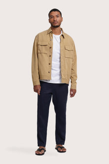 Model wearing the light beige Broo jacket by By The Sea Bali