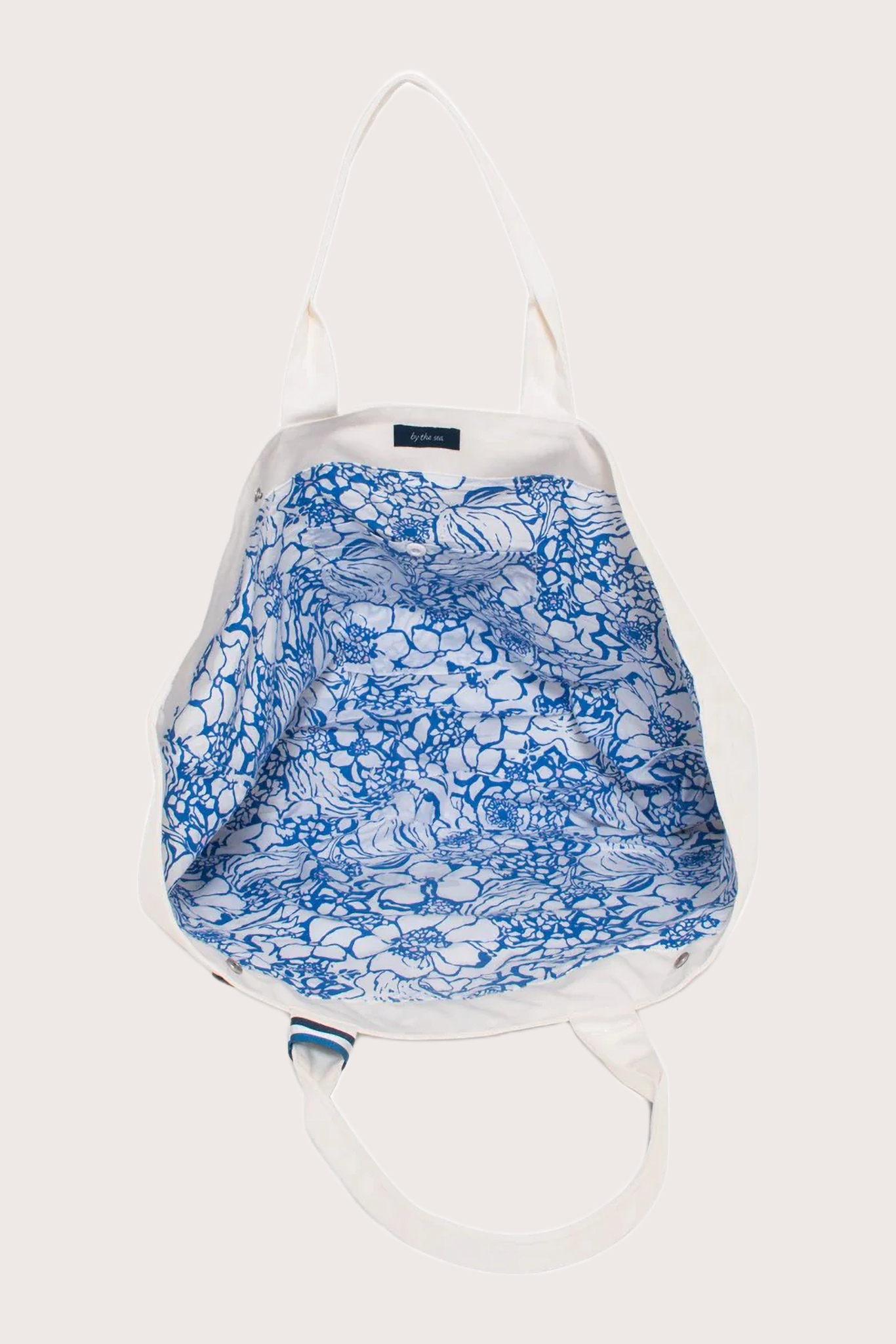 Interior view of By The Sea beach bag revealing spacious compartment and functional design