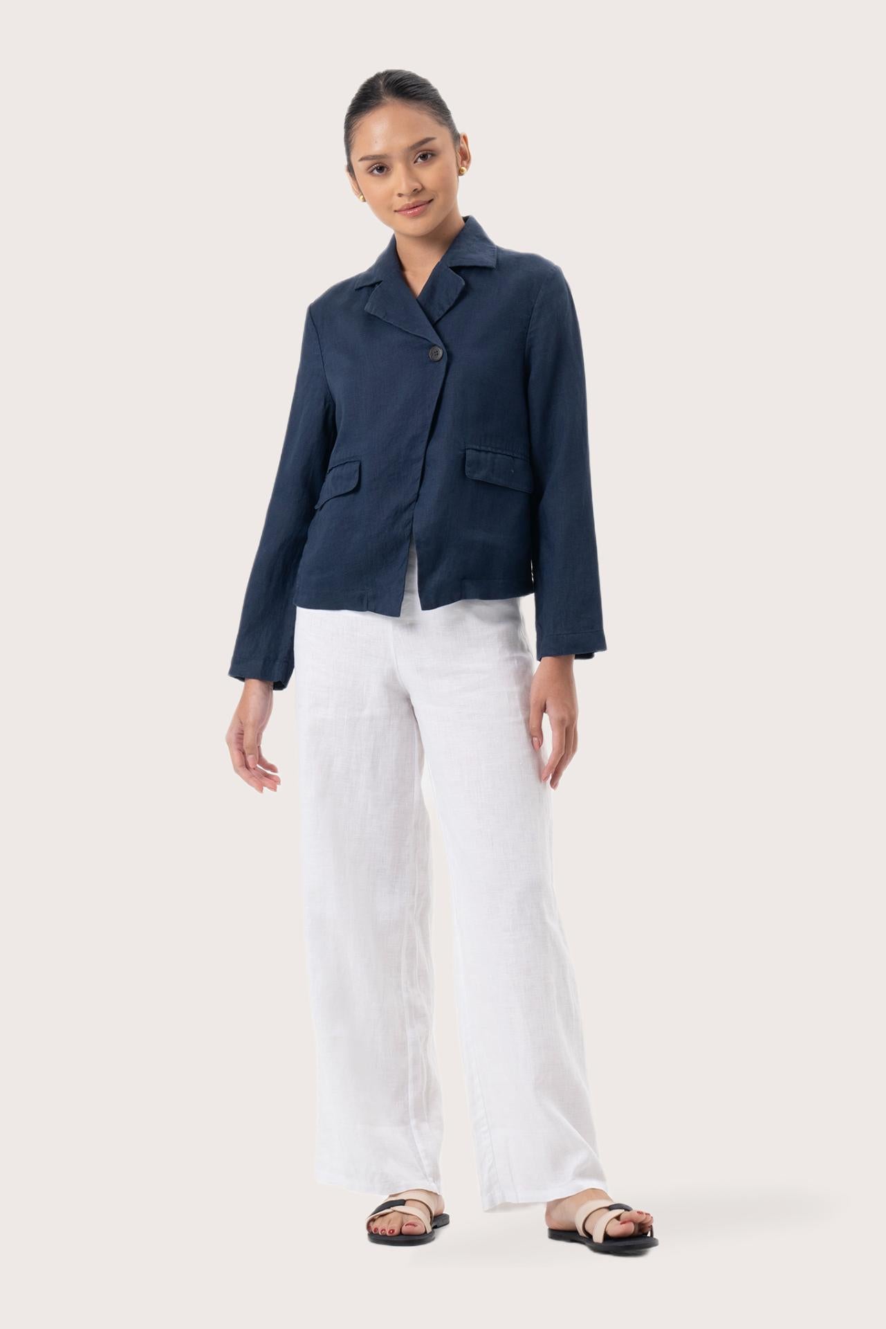 Woman wearing the Cala Linen Blazer Navy designed for effortless resortwear and tropical living by By The Sea Bali