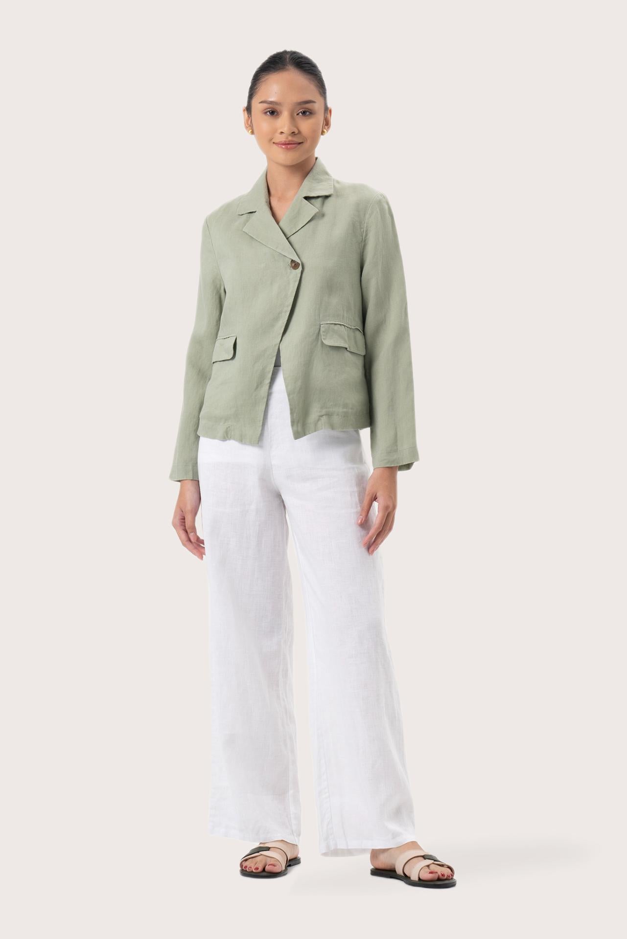 Woman wearing the Cala Linen Blazer Sage designed for effortless resortwear and tropical living by By The Sea Bali