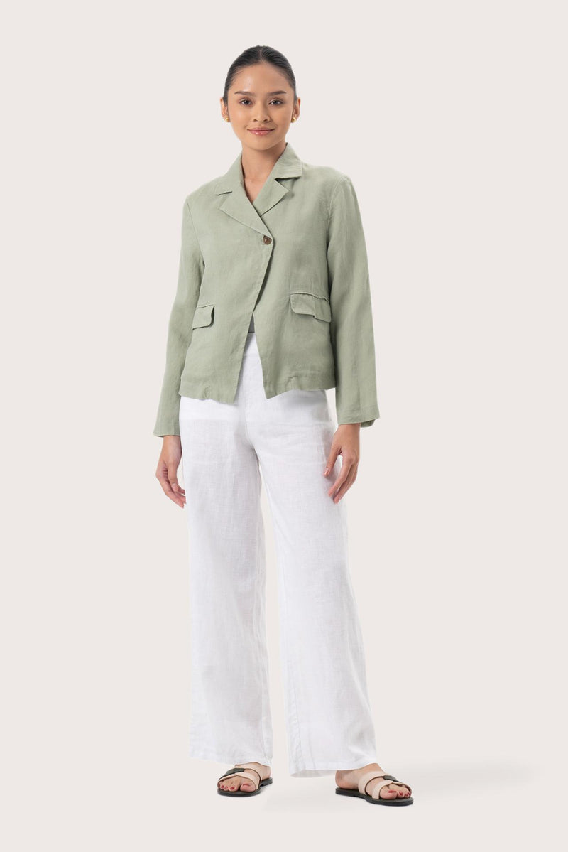 Woman wearing the Cala Linen Blazer Sage designed for effortless resortwear and tropical living by By The Sea Bali