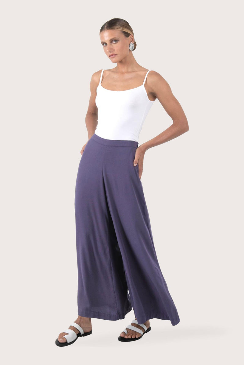 Side profile of the Callie Palazzo Pants Purple showing its cut and natural movement.