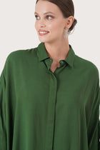 Close up detail of the Candidasa Shirt Green highlighting craftsmanship and design features.