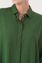 Close up detail of the Candidasa Shirt Green highlighting craftsmanship and design features.