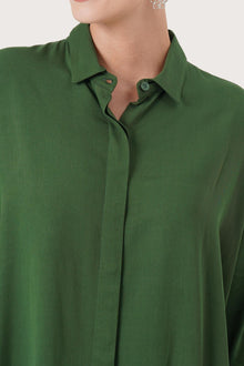Close up detail of the Candidasa Shirt Green highlighting craftsmanship and design features.