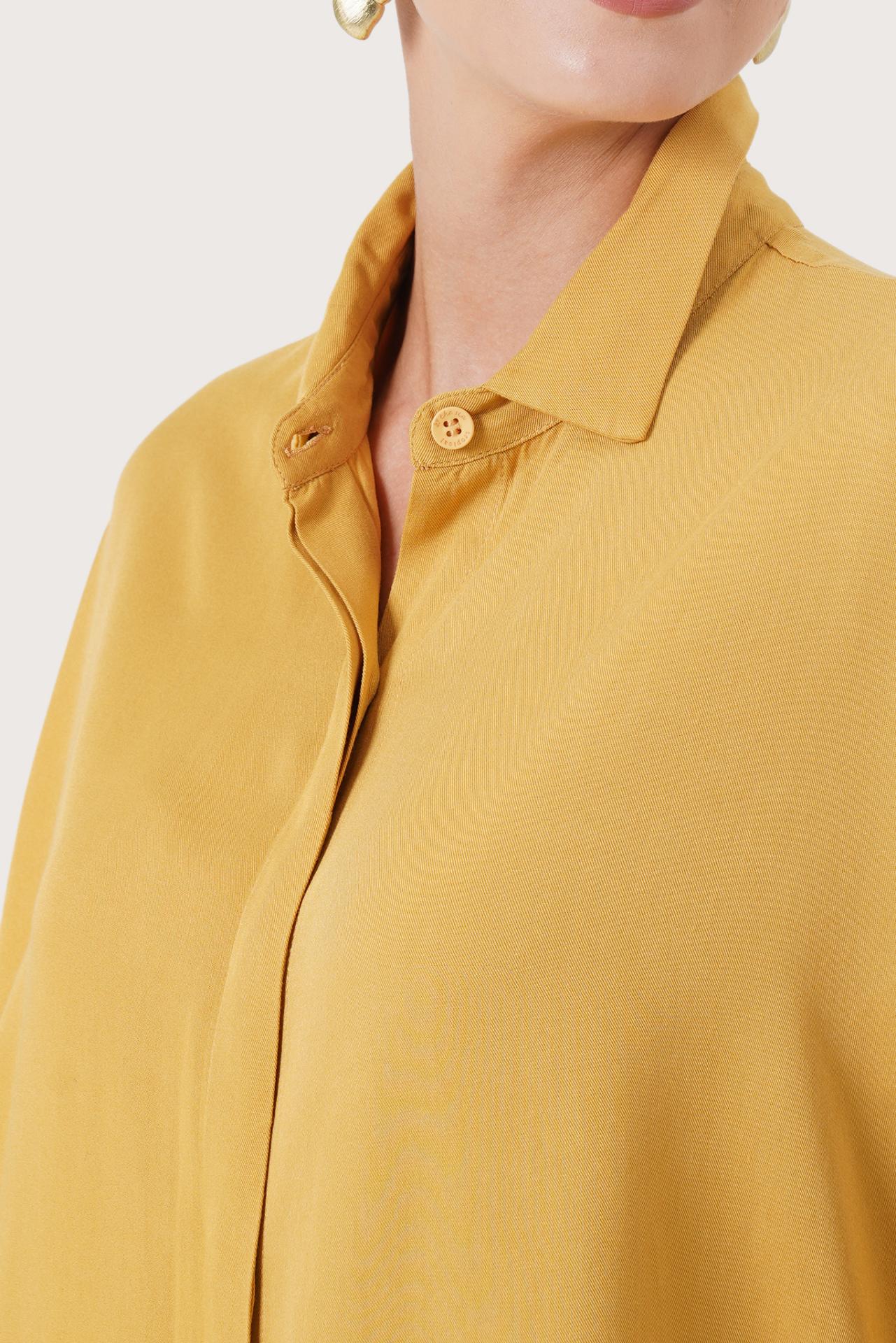 Close up detail of the Candidasa Shirt Yellow highlighting craftsmanship and design features.