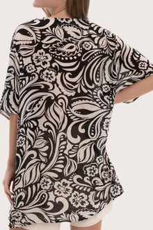 Detailed back view highlighting the paisley print and relaxed fit of the short kaftan