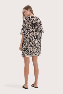 Back view of the black paisley short kaftan with a relaxed flowing silhouette