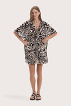 Model wearing the black paisley Canna short kaftan by By The Sea Bali