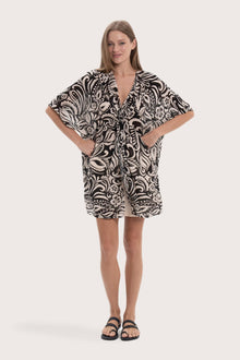 Model wearing the black paisley Canna short kaftan by By The Sea Bali