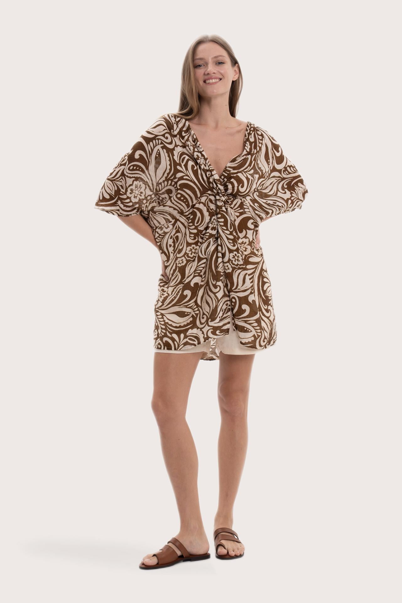 Model wearing the brown paisley Canna short kaftan by By The Sea Bali
