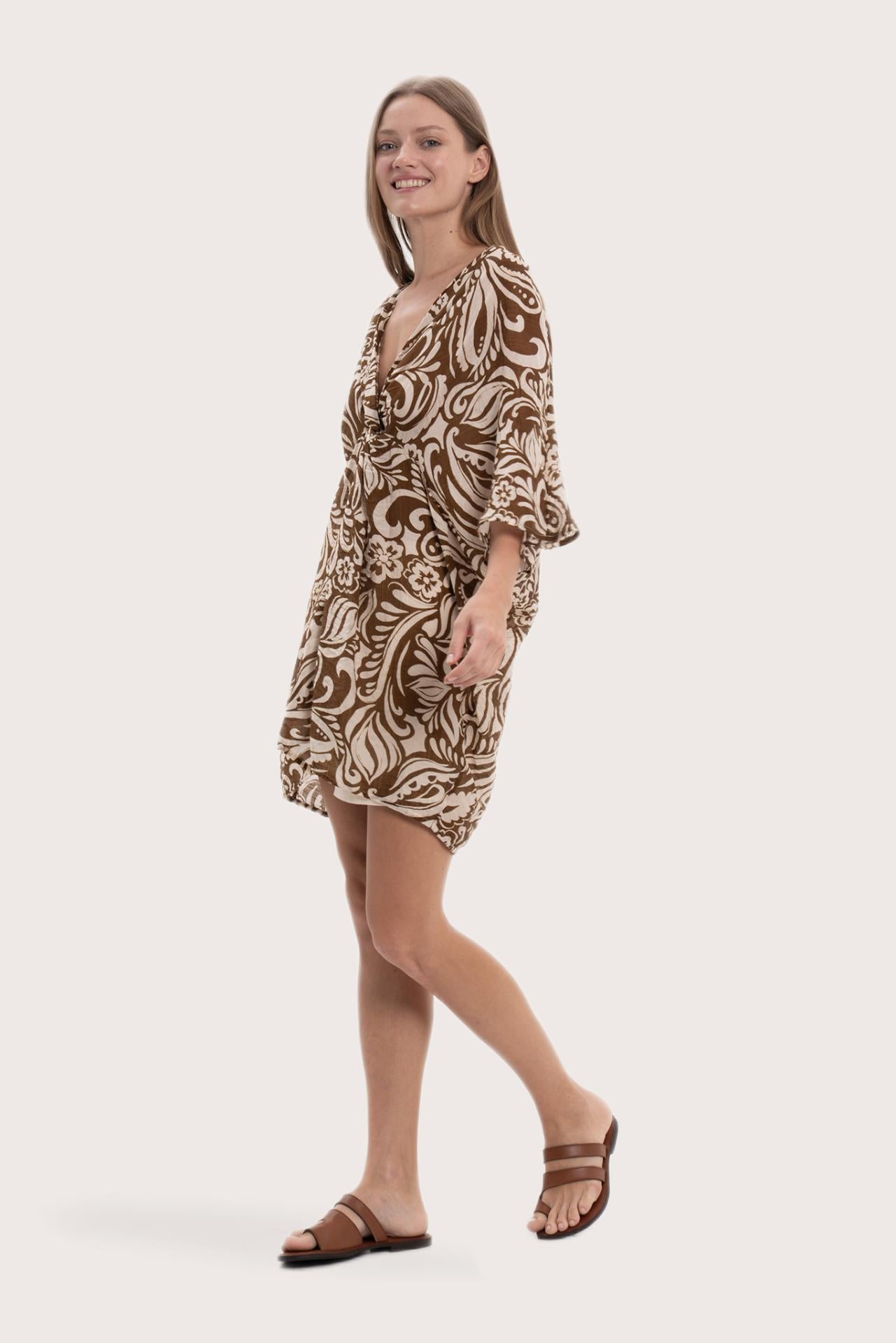 Side profile of the brown paisley short kaftan showcasing its lightweight drape