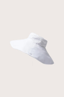 Side view of the Capri Linen Hat highlighting its soft linen structure and airy resort shape