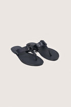 Angled view of the black leather Cate sandals showcasing their elegant design