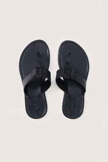 Black leather Cate sandals by By The Sea Bali displayed from the front