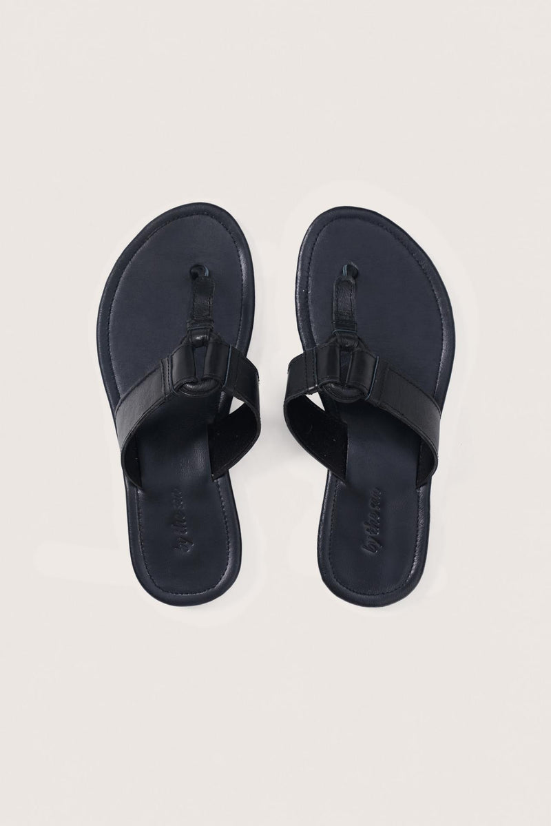 Black leather Cate sandals by By The Sea Bali displayed from the front