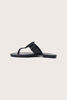 Side profile of the black leather Cate sandals highlighting the strap design