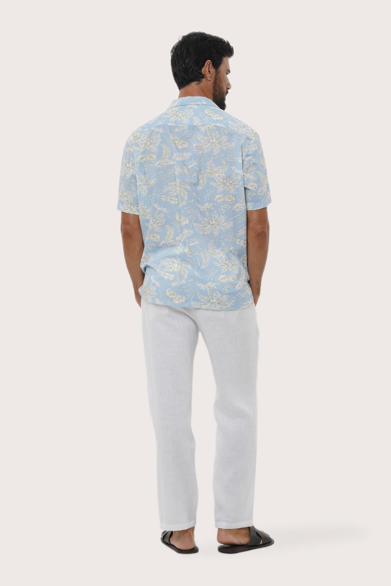 Open camp collar and button-front detail of the Chalet Shirt in Coconut Island Light Blue by By The Sea Bali