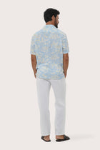Open camp collar and button-front detail of the Chalet Shirt in Coconut Island Light Blue by By The Sea Bali