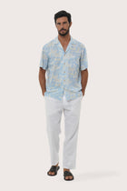 Front view of the Chalet Shirt in Coconut Island Light Blue print by By The Sea Bali